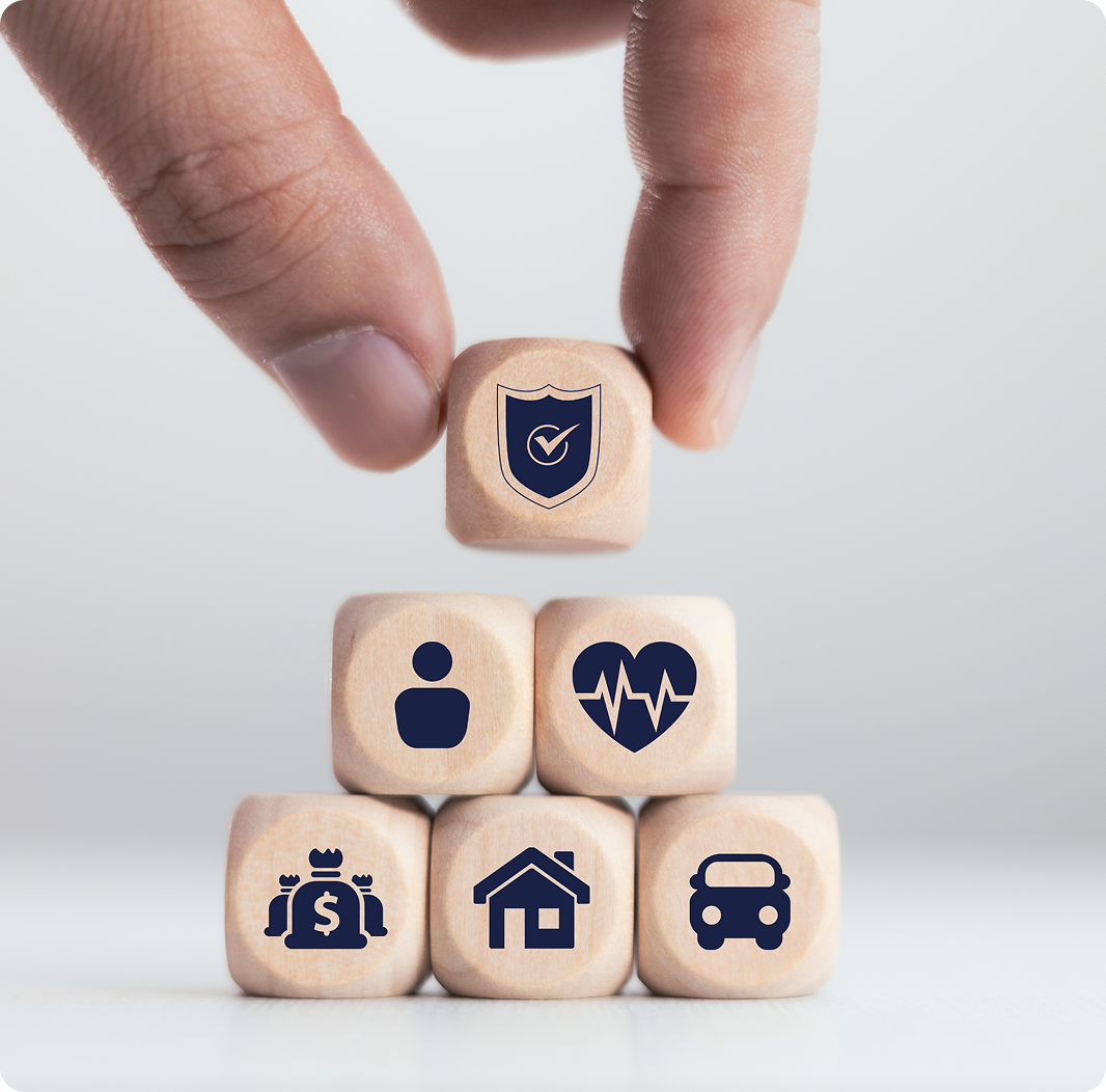 Stacked wooden blocks with insurance icons