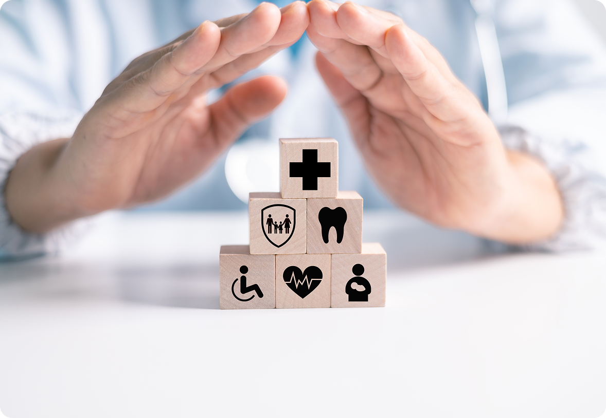 Healthcare icons under protective hands