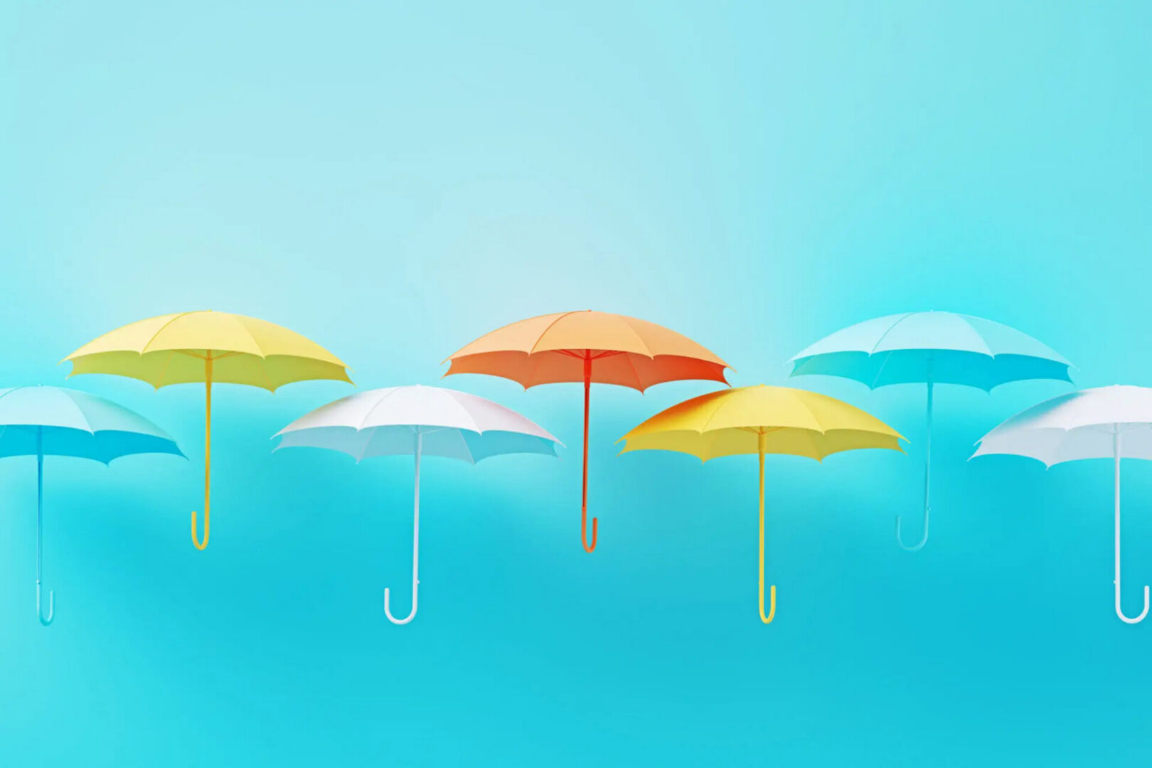 Colorful umbrellas floating on turquoise background