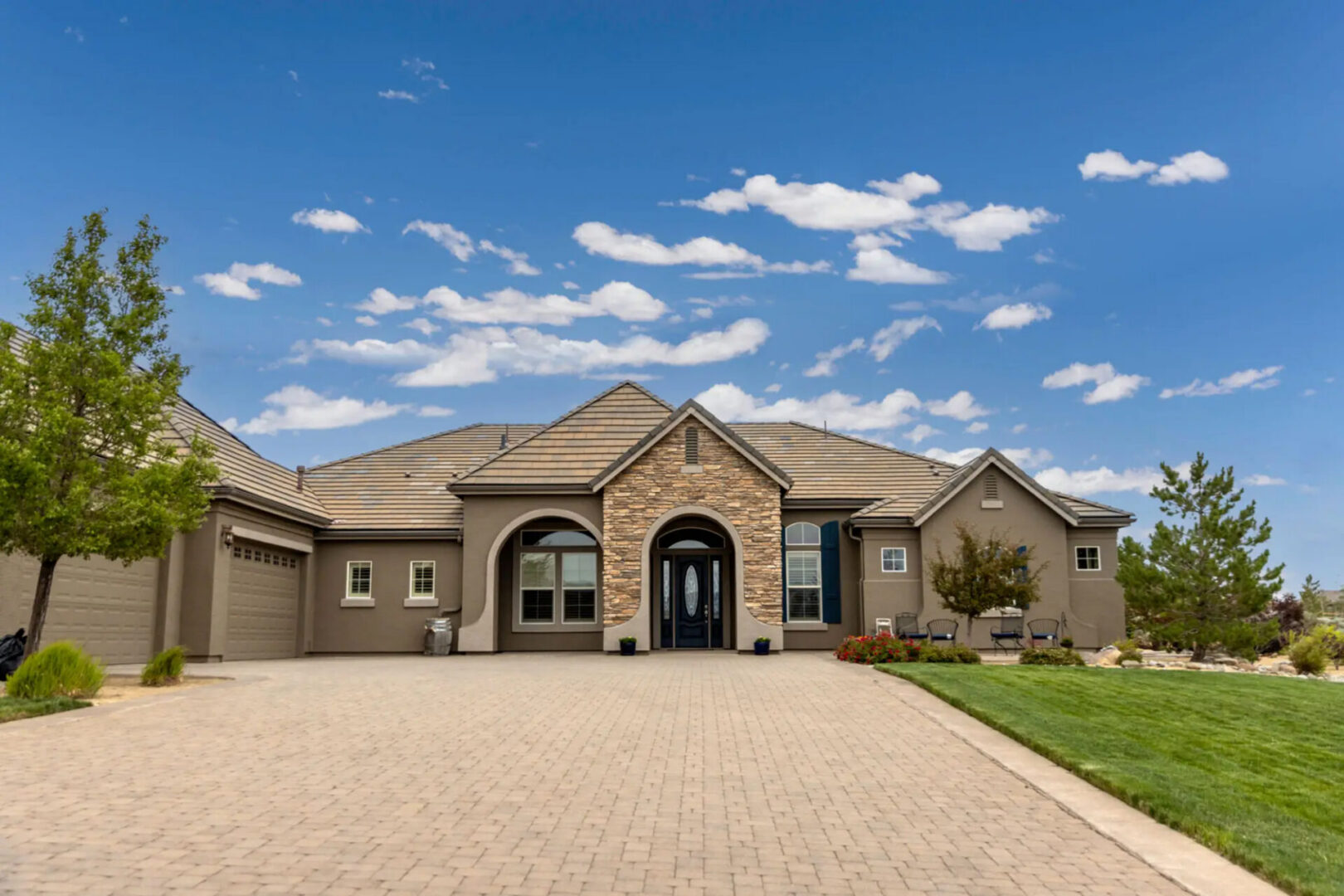 Luxury single-story house with arched stone entrance
