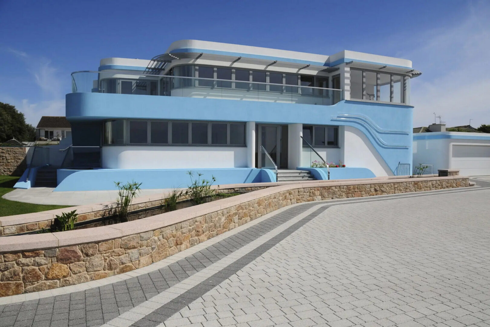 Modern light-blue Art Deco house exterior
